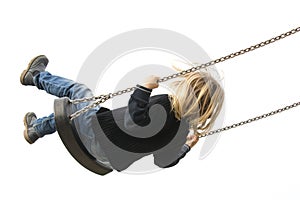 Little child blond girl having fun on a swing outdoor.