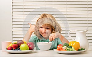 Little child boy having healthy breakfast. Kids nutrition and development. Eating vegetables by child make them