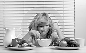 Little child boy having healthy breakfast. Kids nutrition and development. Eating vegetables by child make them