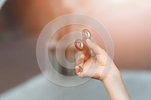 Little child boy playing with fidget spinner outdoors