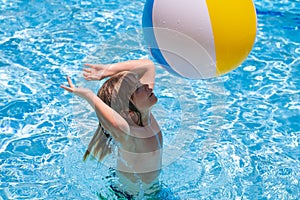 Little child boy in swimming pool with inflatable toy ring. Children summer vacation. Swim for child on float. Beach sea