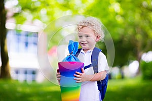 Little child with candy cone on first school day