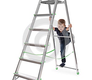 Little child climbing up ladder on background. Danger at home