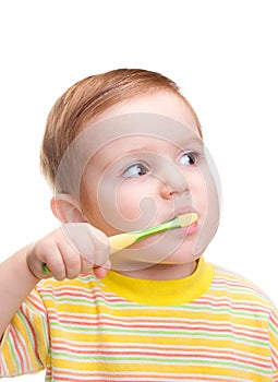 Little child with dental toothbrush brushing teeth