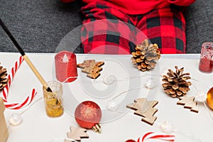 Little child doing crafts Christmas tree decorations