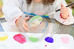 Little Child Drawing On Stone Outdoors On Summer Sunny Day.