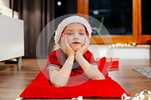 Little child dreaming about Christmas.