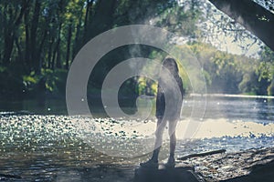 Little child in dusty atmosphere in river bank, weird image
