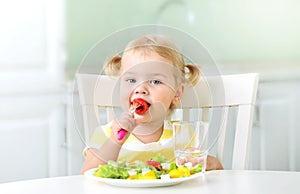 Little child eating healthy food vegetables salad,kid`s nutrition