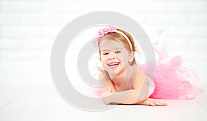 Little child girl dreams of becoming ballerina