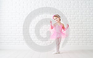 Little child girl dreams of becoming ballerina