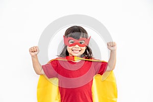 Little child girl plays superhero. Child on the white background. Girl power concept