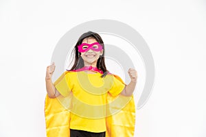 Little child girl plays superhero. Child on the white background. Girl power concept