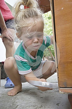 Little child and hammer photo