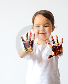 Little child hands painted in colorful paints isolated