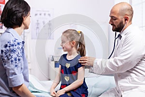 Little child having consultation-hour in medical office