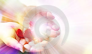 Little child holding red hearts, close up  on white background