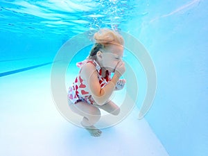 Little Child Learning to Swim Under Water