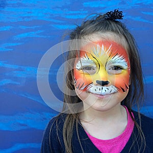 Little child with lion face painting