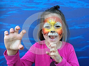 Little child with lion face painting