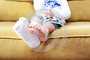 Little child with plaster bandage on leg heel fractured photo