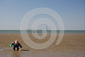 Little Child playing the beach