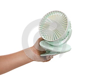 Little child with portable fan on white background, closeup. Summer heat