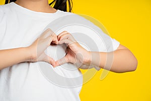 Little child`s hands gesture in heart shape showing love and kindness. Concept of Health care, Love, World heart day