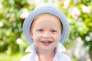 Little child smiling face. Enjoy walk. Funny boy. Close up kids portrait.