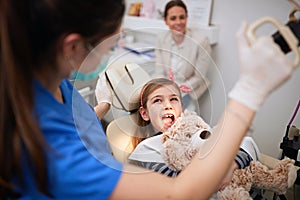 Little child at stomatology. Girl with dentist.Family  Health teeth concept photo