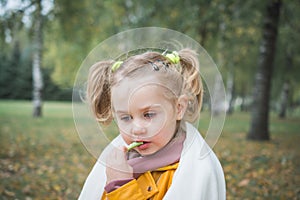 Little child three year old girl playing in the park