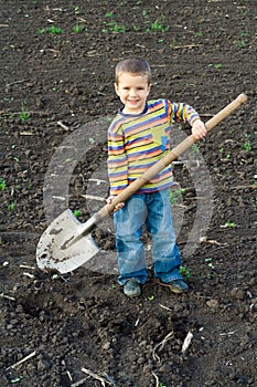 Little children with big shovel