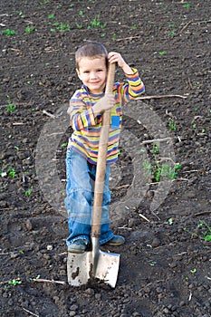 Little children with big shovel