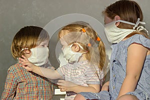 Little children in home-made gauze bandages, masks