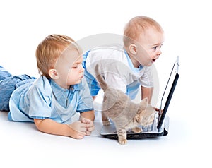 Little children, kitten, and laptop