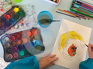 Little children painting, drawing, creating with colors_montessori school education concept