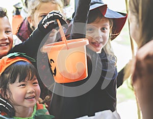 Little children trick or treating on Halloween photo