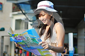 Little Chinese Asian Tourist Girl using her map 2