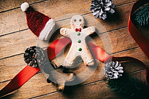 Little Christmas gingerbread man cookie with Santa Claus hat