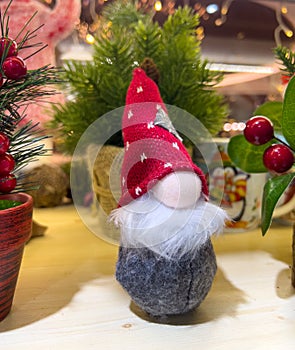 little christmas gnome gonk on decorated background mobile photo