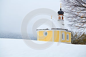 Little church in Alps during winter