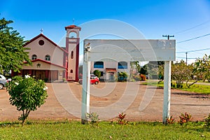 Little church in tropics with a blank sign