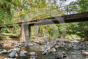 Little Concrete bridge over Rill in forest photo