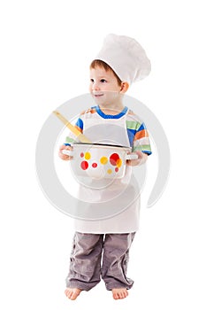 Little cook standing with ladle and pan