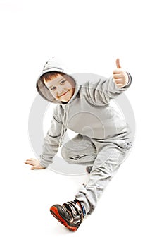 Little cool hip-hop boy in dance showing ok sign