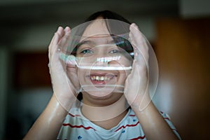 Little creative kid having fun with soap bubble during lockdown