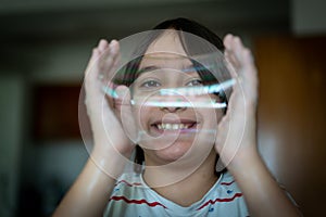 Little creative kid having fun with soap bubble during lockdown