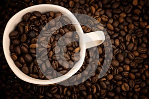 Little cup for expreso full coffe beans photo