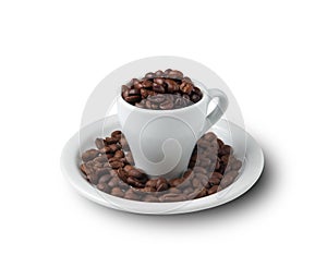 Little cup filled with coffee beans on saucer