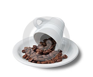Little cup with scattered coffee beans lying on saucer